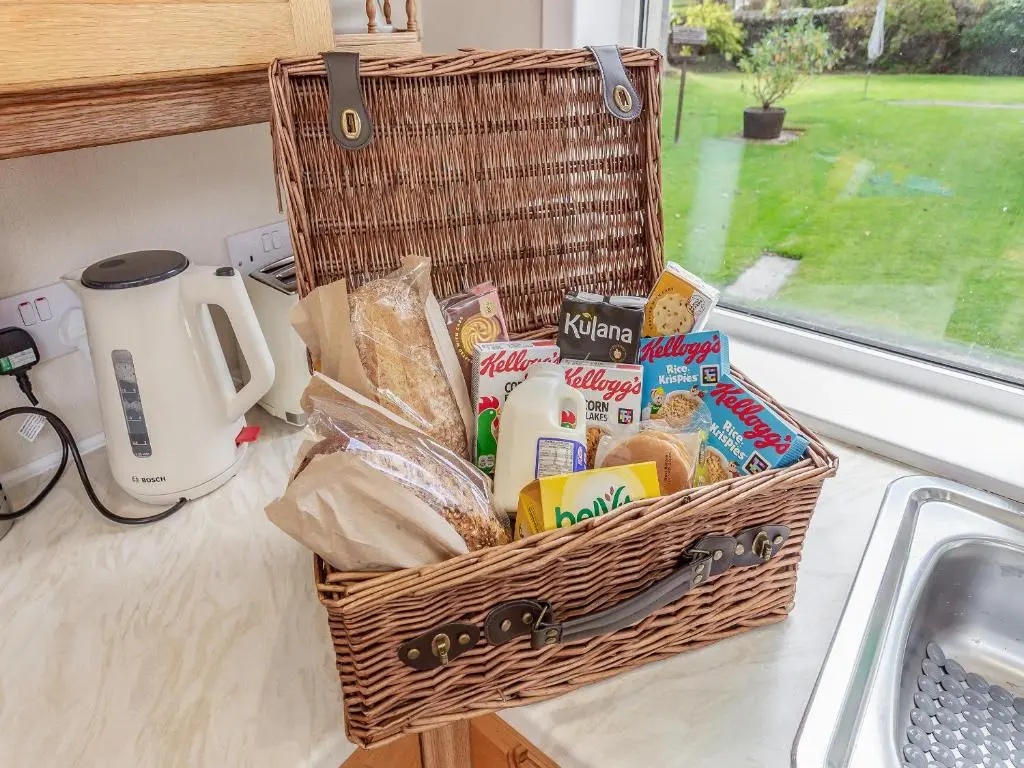 a basket of food on a counter next to a sink at Tanera in Wick