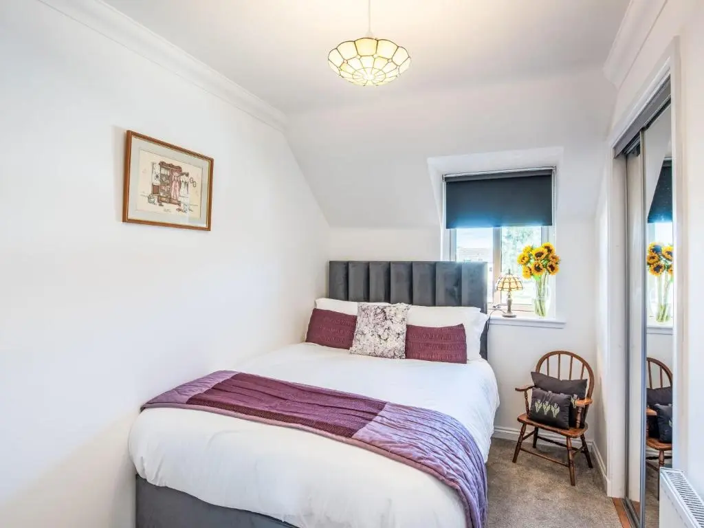 a bedroom with a bed and a window at Apartment Varis Haven by Interhome in Forres