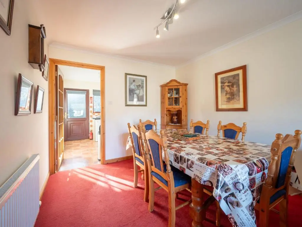 a dining room with a table and chairs at Holiday Home Coiltie House by Interhome in Drumnadrochit