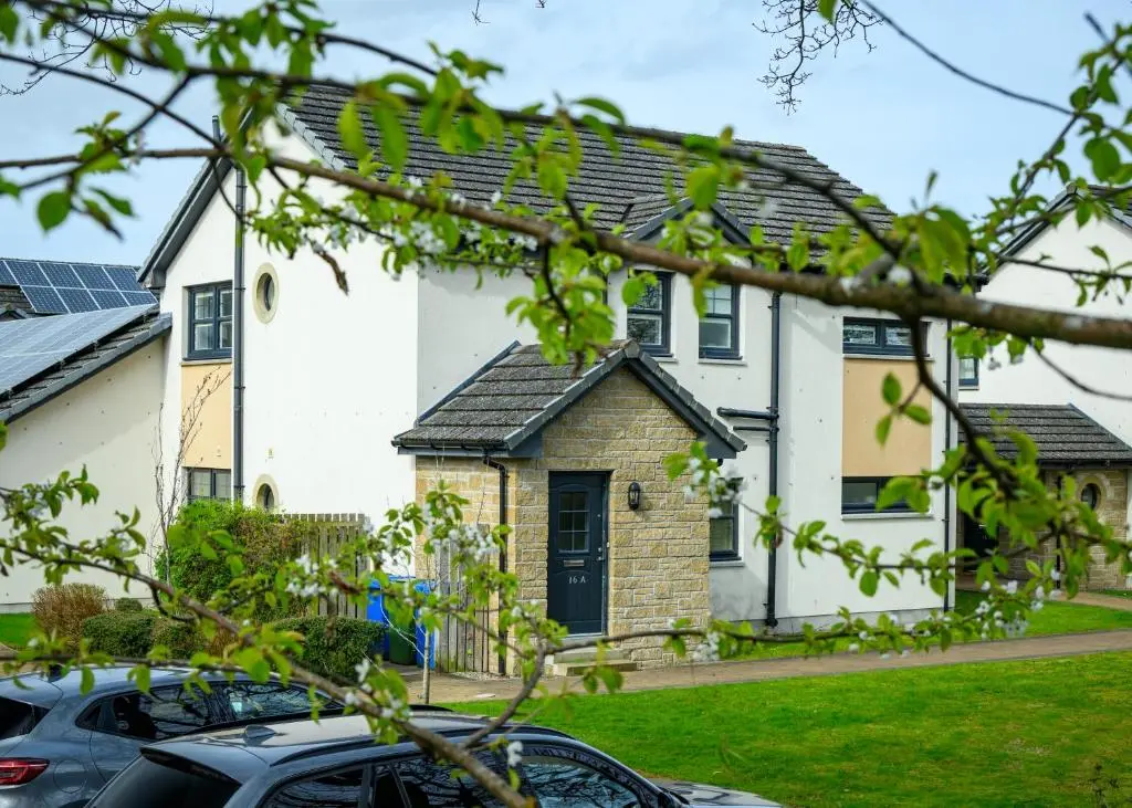 a house with cars parked in front of it at 2 Bed Property, Beauly in Beauly