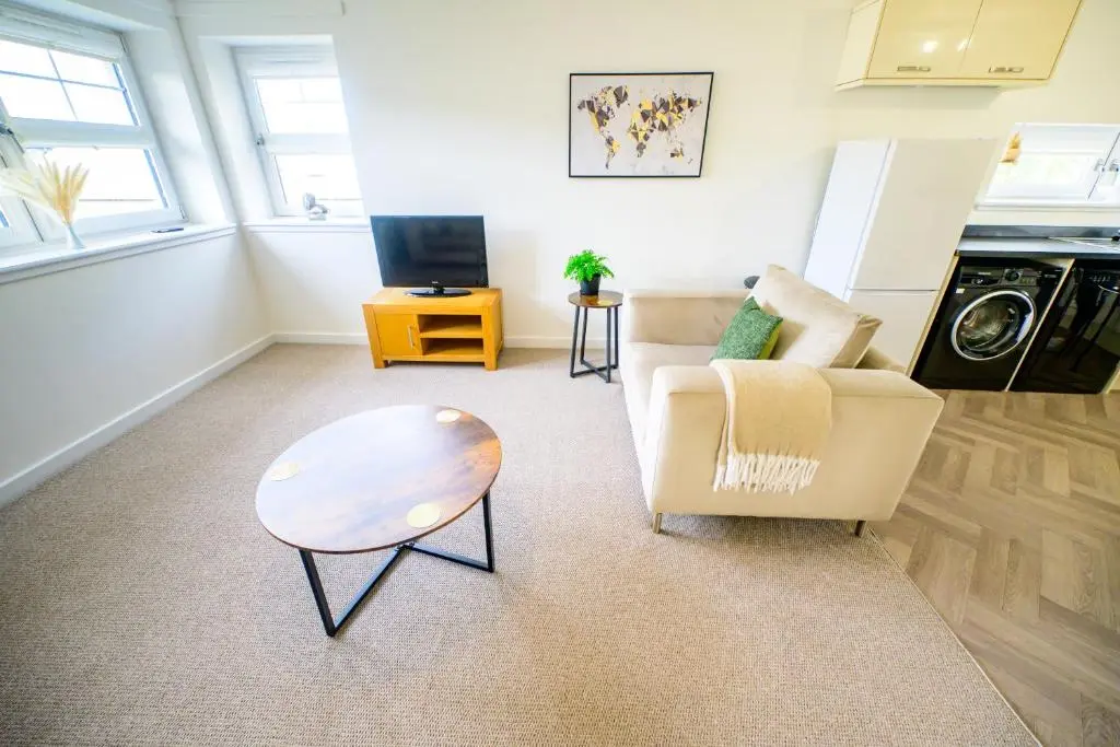 a living room with a couch and a coffee table at 2 Bed Property, Beauly in Beauly