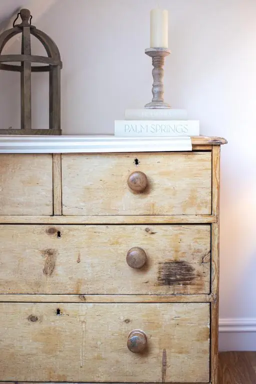 a wooden dresser with a candle on top of it at Lillymont Apartment - Inverness City Centre in Inverness