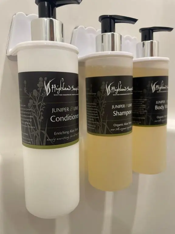a group of three bottles of hair products on a counter at Whispering Dunes - Silver Sands Holiday Park in Lossiemouth
