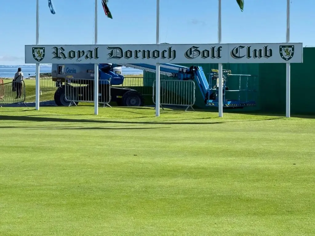 a sign for aoval burrow golf club on a field at Sunny Firth in Tain