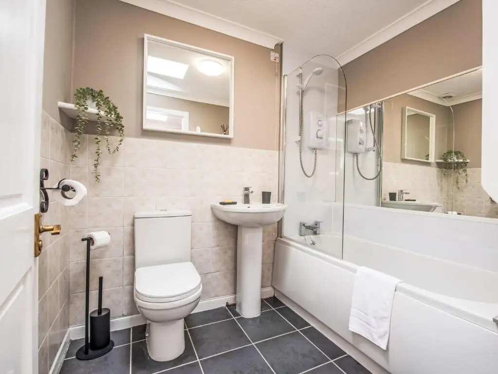a bathroom with a toilet and a sink and a tub at Holiday Home Highland View by Interhome in Drumnadrochit