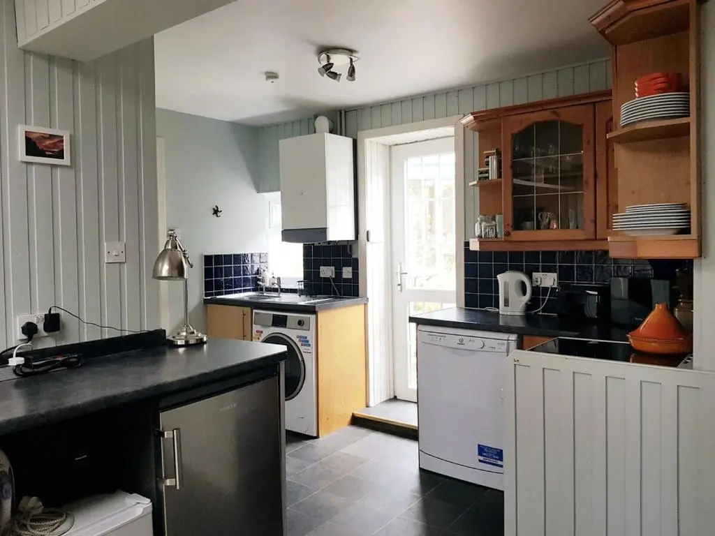 a kitchen with a sink and a dishwasher at Institution Road in Elgin