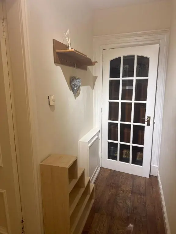a room with stairs and a door with a window at Georges 47 king street Apartment in Inverness