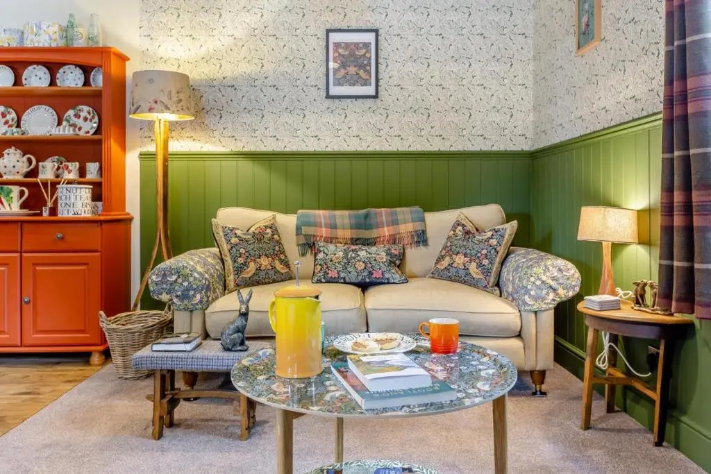 a living room with a couch and a table at 2 Bed in Invergordon oc-c33073 in Invergordon