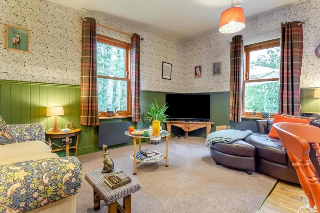 a living room with a couch and a tv at 2 Bed in Invergordon oc-c33073 in Invergordon