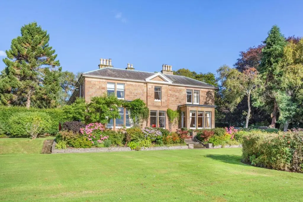 a large brick house with a large yard at 8 Bed in Invergordon oc-p32711 in Invergordon