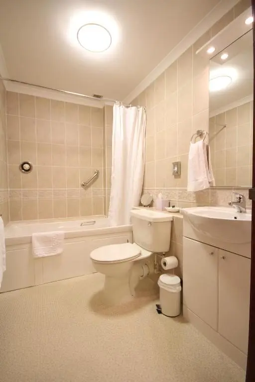 a bathroom with a toilet and a sink at Strathburn Hotel Inverurie by Compass Hospitality in Inverurie