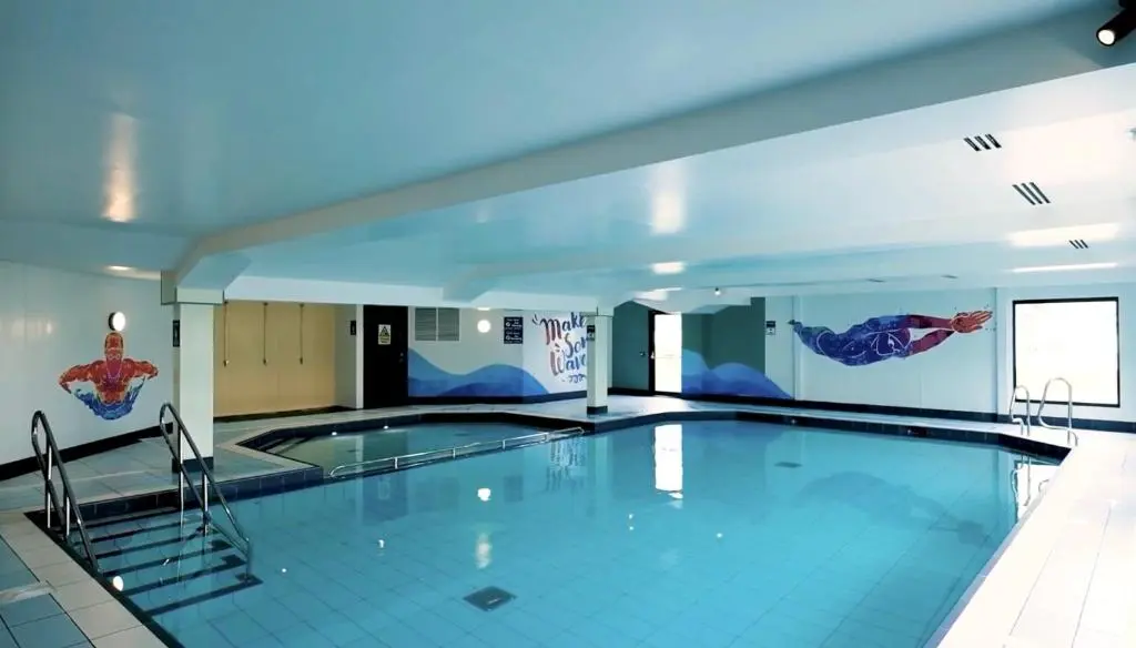 a large swimming pool in a building at Sand Dollar, Silver Sands Holiday Park in Lossiemouth