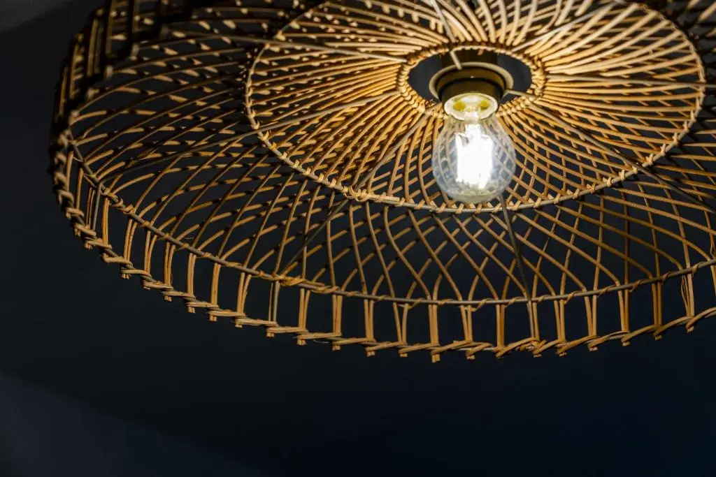 a light hanging from a ceiling with a fan at King Cosy 2 Bedroom Apartment - Inverness in Inverness