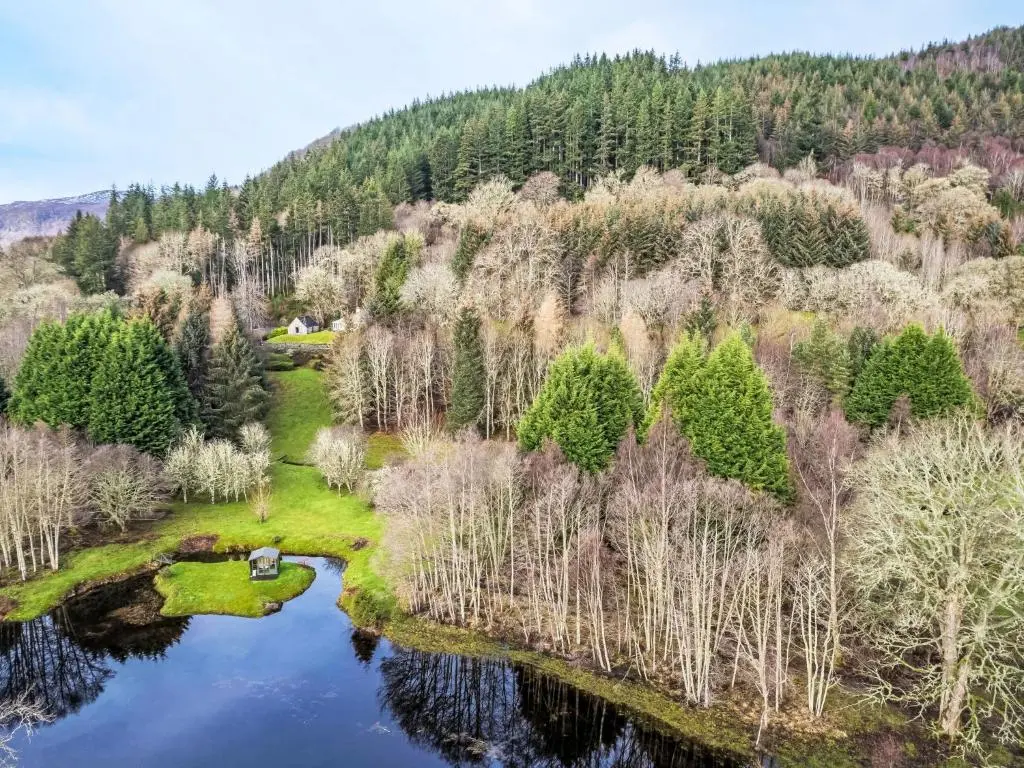 an aerial view of a river in a forest at Holiday Home The Romantic Bothy by Interhome in Invermoriston