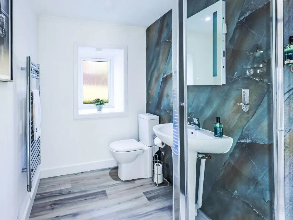 a bathroom with a toilet and a sink at Holiday Home Gordonstoun Cottage by Interhome in Elgin