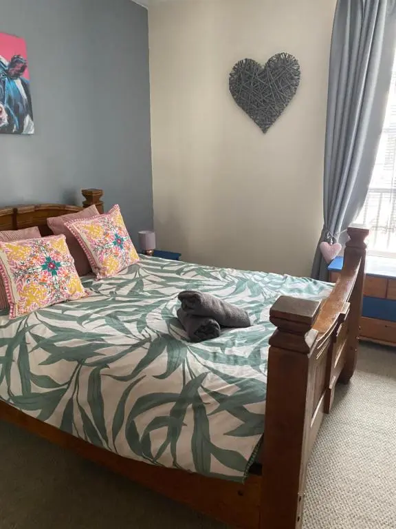 a bedroom with a bed with a stuffed animal on it at Church st 48B in Inverness