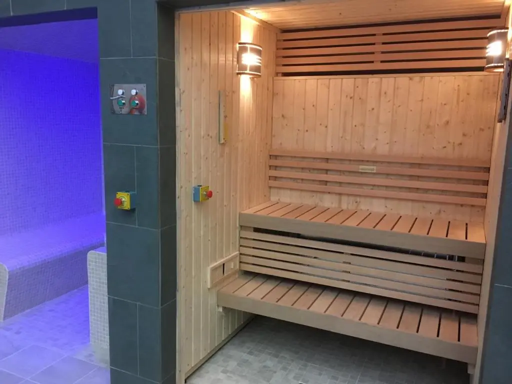 a sauna with wooden panels and a purple at Abbey Church 20 in Fort Augustus