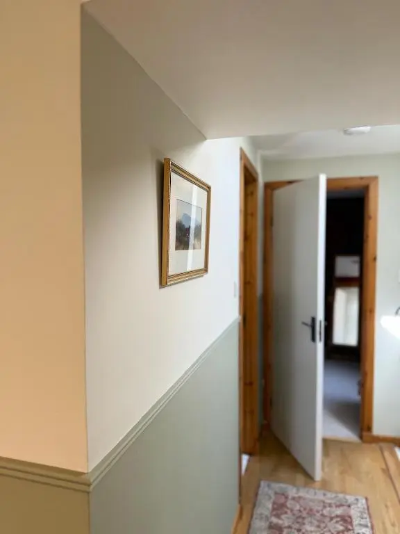 a hallway with a stairway leading into a house at Friar's Rest - Beauly Village in Beauly