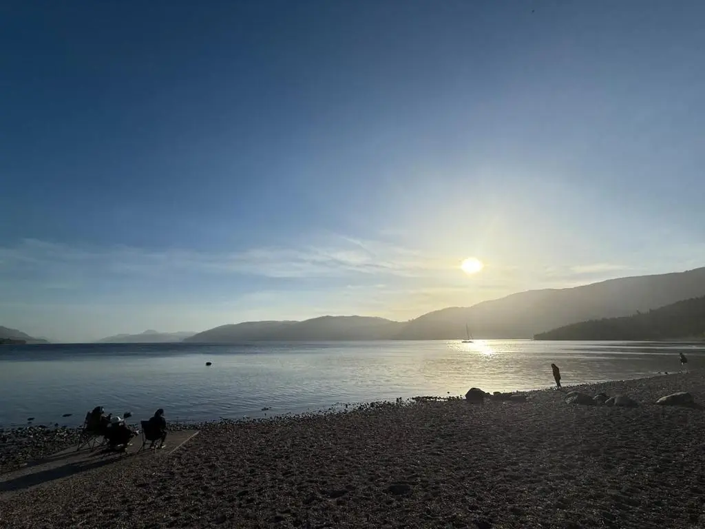 a group of people on a beach near the water at Friar's Rest - Beauly Village in Beauly