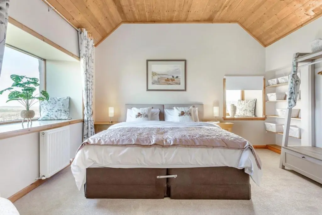 a bedroom with a large bed and a window at 1 Bed in Wick oc-b33442 in Wick