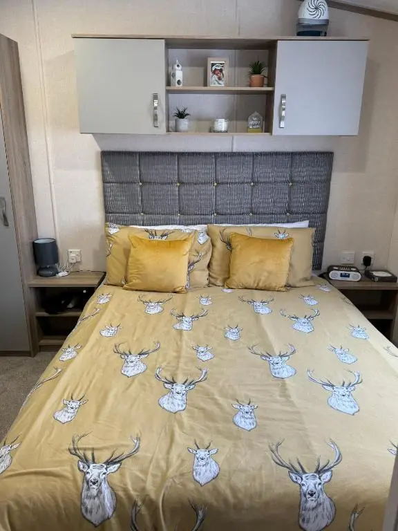 a bed with deer heads on top of it at Sutherland C14 in Lossiemouth