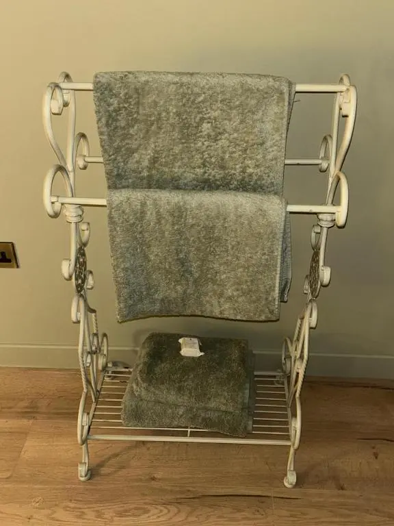 a towel rack with towels on it in a room at Luxury Lodge by Findhorn Sands No 18 in Findhorn