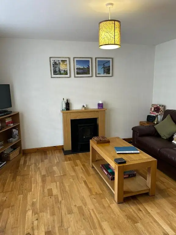 a living room with a couch and a coffee table at Cosy 1 bedroom ground floor flat, Central Inverness in Inverness