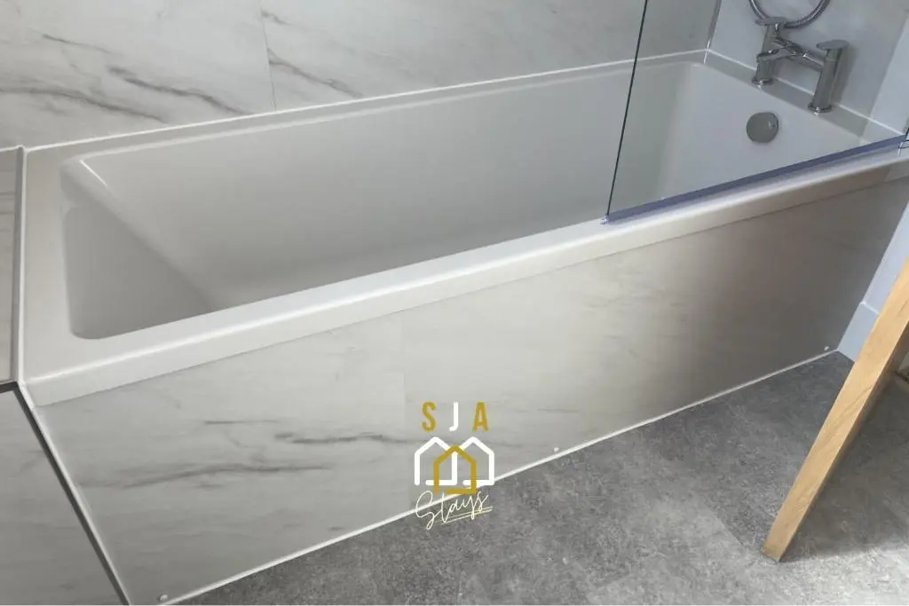 a white bathtub in a bathroom with a sink at Beachside Cottage - SJA Stays - Modern 3 Bedroom House in Cullen