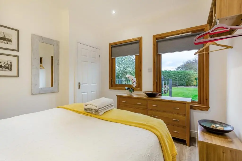 a bedroom with a large bed and a window at 1 Bed in Inverness oc-a33726 in Inverness