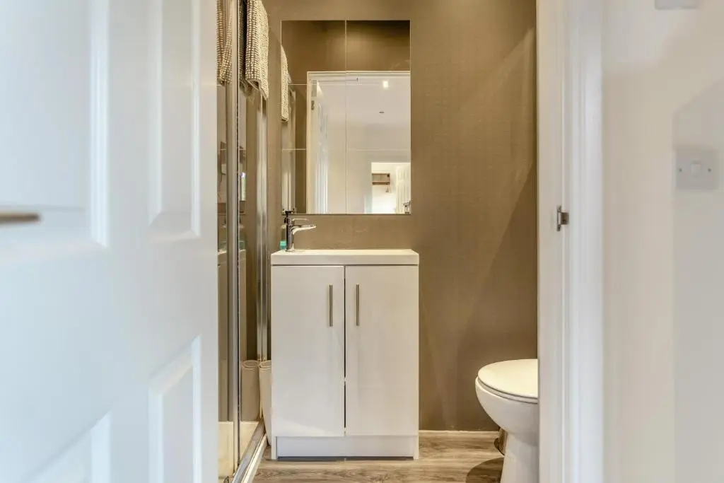 a bathroom with a white sink and a toilet at 1 Bed in Inverness oc-a33726 in Inverness