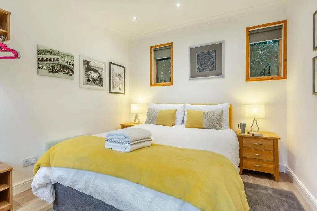 a bedroom with a bed with two towels on it at 1 Bed in Inverness oc-a33726 in Inverness
