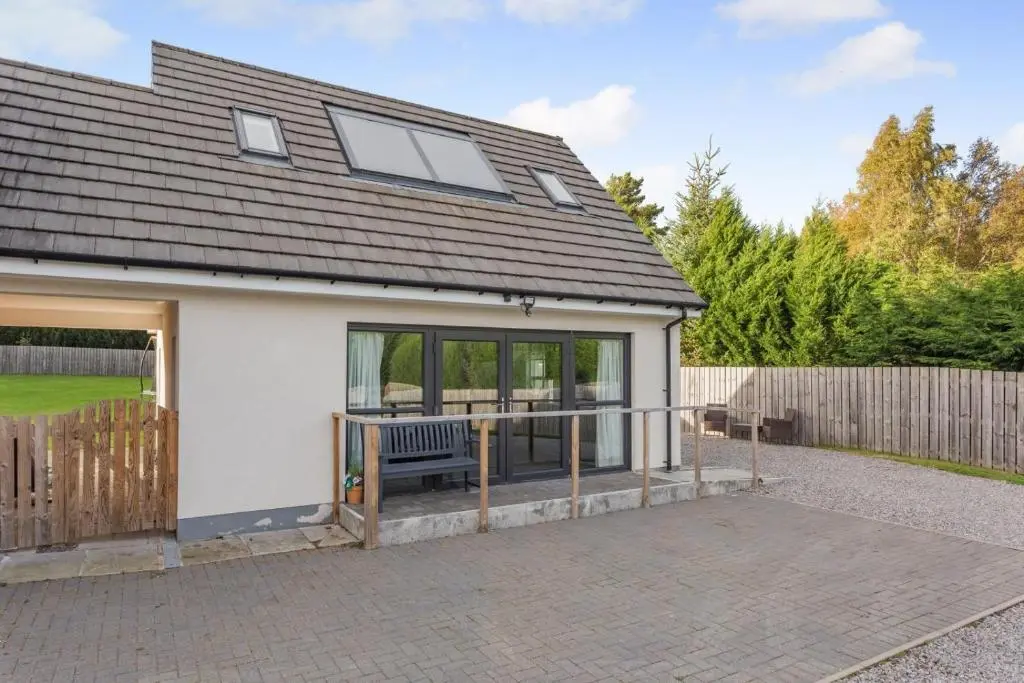 a house with a porch with a bench in it at 1 Bed in Daviot oc-c33520 in Daviot
