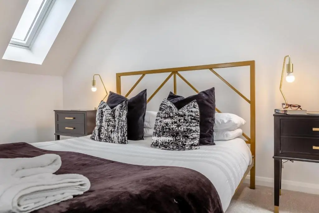 a bedroom with a large bed with pillows on it at 1 Bed in Daviot oc-c33520 in Daviot