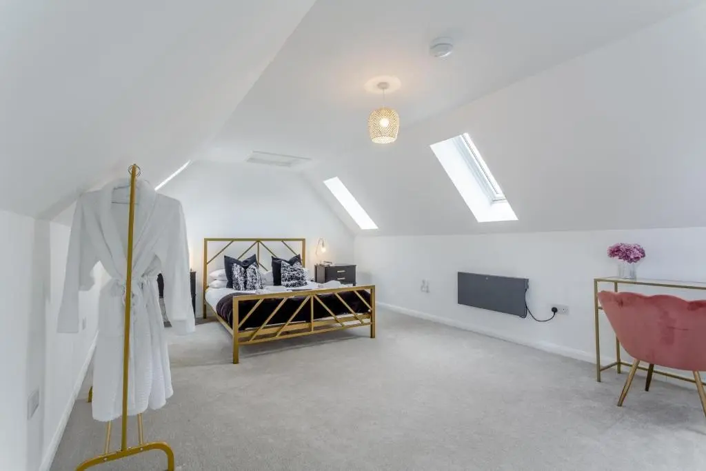 a bedroom with a bed and a table and chairs at 1 Bed in Daviot oc-c33520 in Daviot
