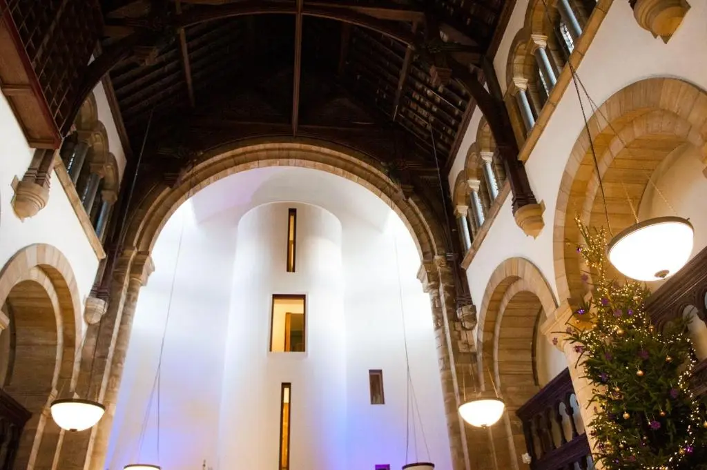a large building with arched ceilings and lights at Raven Wing 11 - Kintail Apartment in Fort Augustus