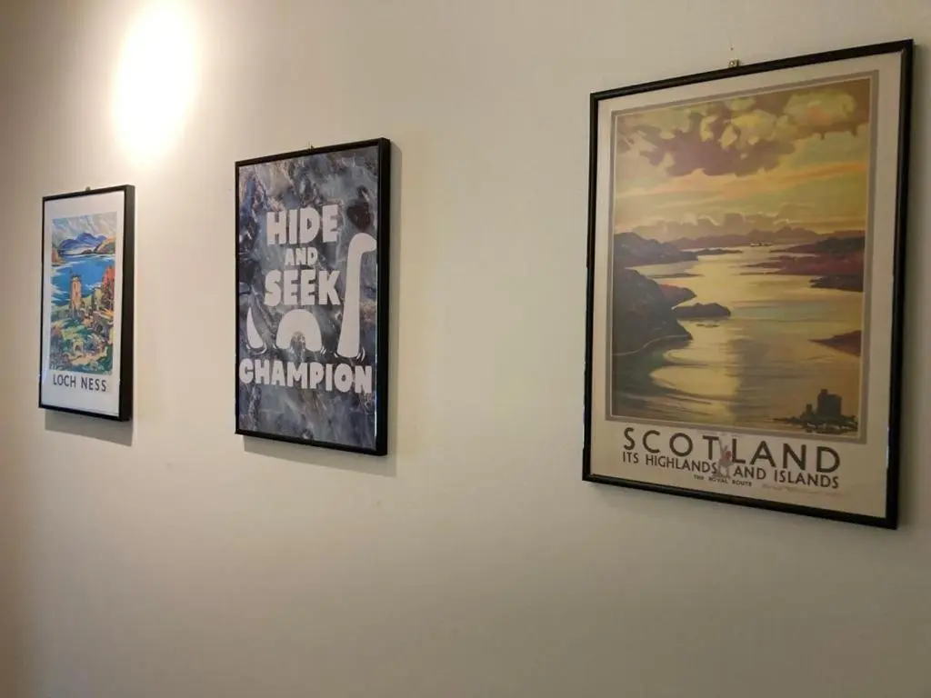 three framed posters hanging on a wall at Raven Wing 17 - Aonach Mor in Fort Augustus