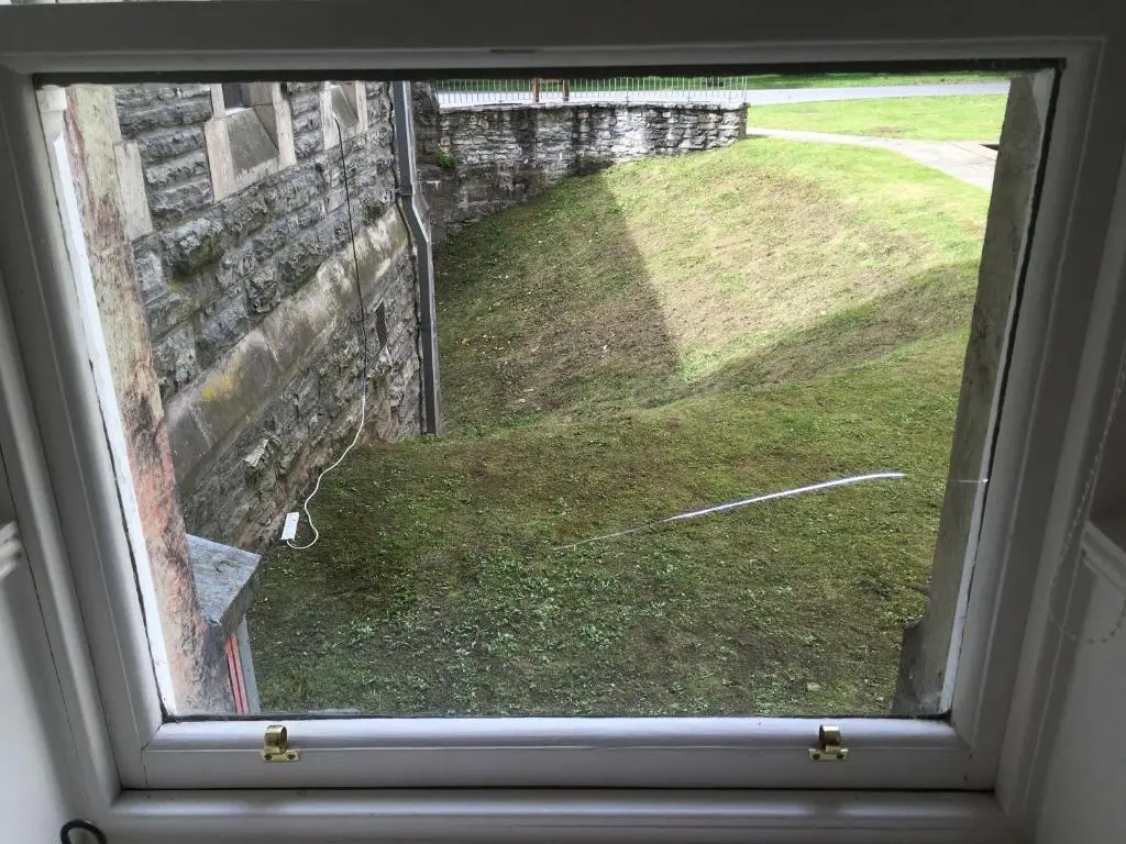 a window with a view of a field of grass at Moat House 1 in Fort Augustus