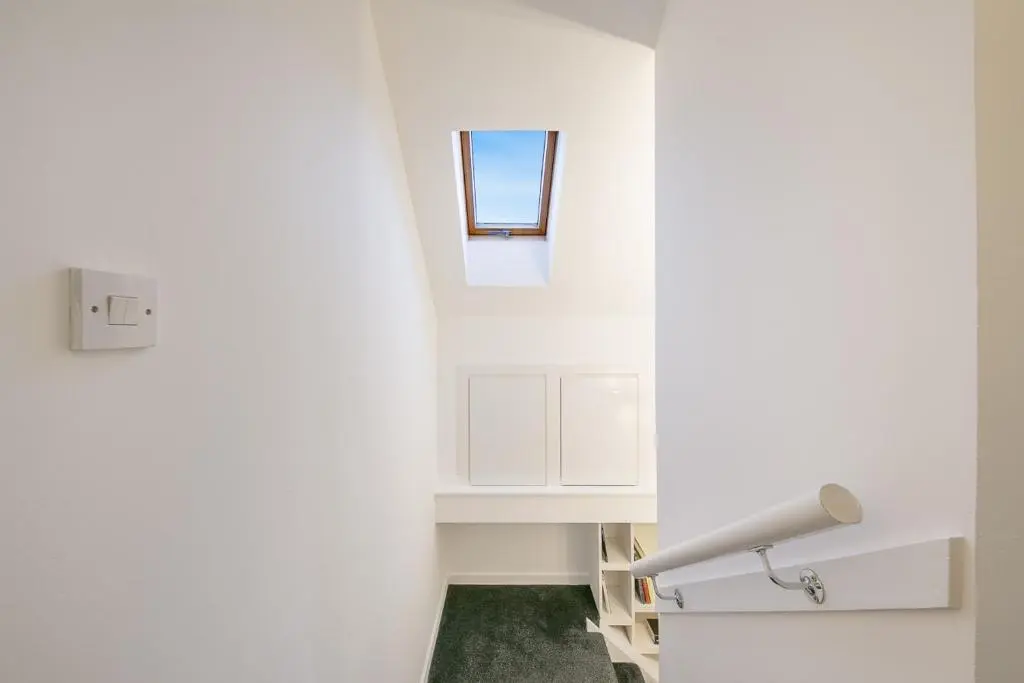 a bathroom with white cabinets and a window at Rooemah Lodge - Grampian Lettings in Caskieben