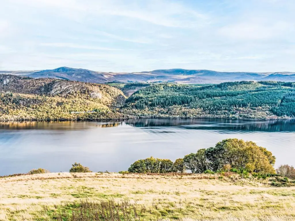 a view of a lake with mountains in the background at Holiday Home Wester Bunloit by Interhome in Drumnadrochit