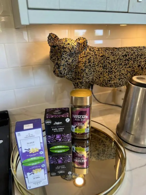 a counter top with a bear and some products on it at Beautiful Highland Sanctuary in Embo