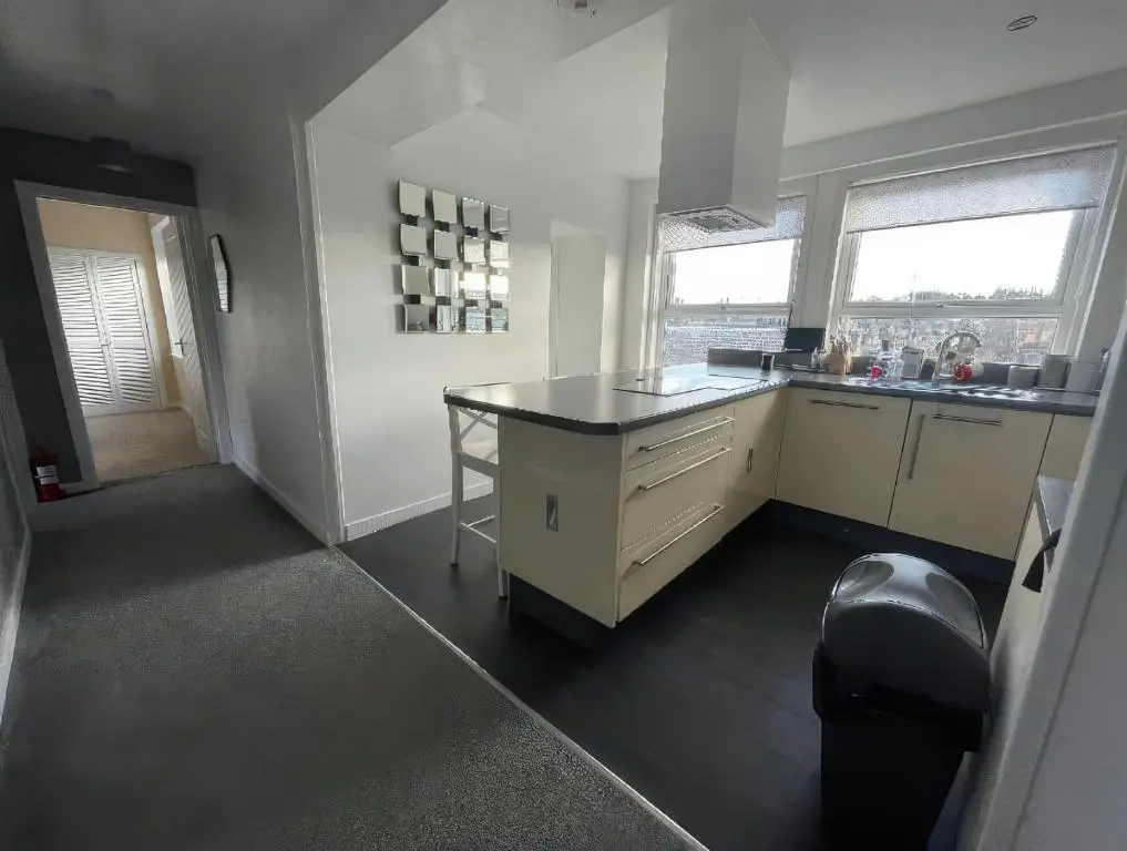 a kitchen with a island in the middle of it at Home in Forres, Moray in Forres