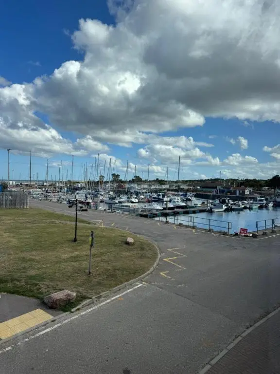 a marina with boats docked in a harbor at Firth Tides in Nairn