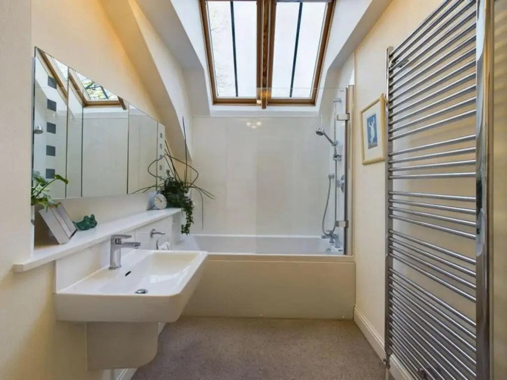 a bathroom with a sink and a bath tub at Turfhill House in New Deer