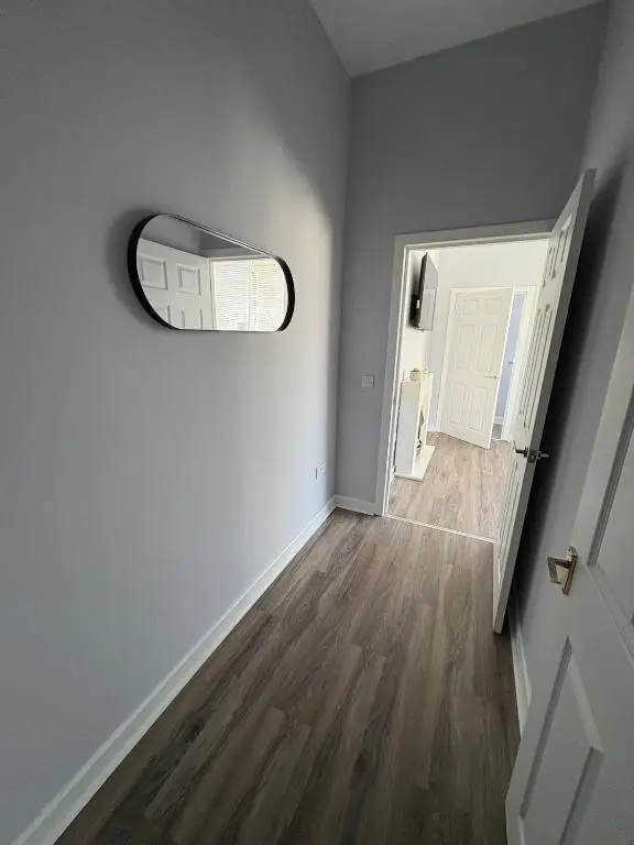 an empty hallway with a door and a window at Charming 2 bed in Aberchirder in Aberchirder