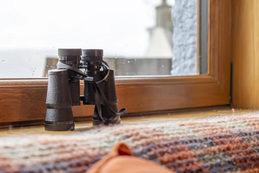 a camera on the floor next to a window at Beinn View 3 Bedroom House - Sea View - Ardersier in Ardersier