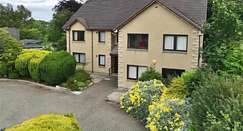 a house with a garden in front of it at 2 Bedroom Macewen Drive in Inverness