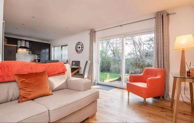 a living room with a couch and a chair at 2 Bedroom Macewen Drive in Inverness