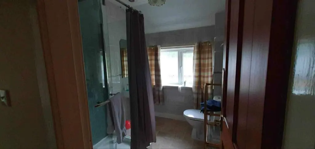 a bathroom with a toilet and a sink at River View in Garve