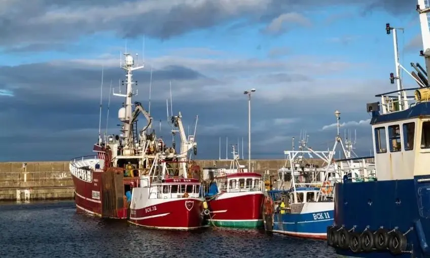 a group of boats parked in the water at Rook View, Modern Coastal Retreat with Free Parking in Buckie