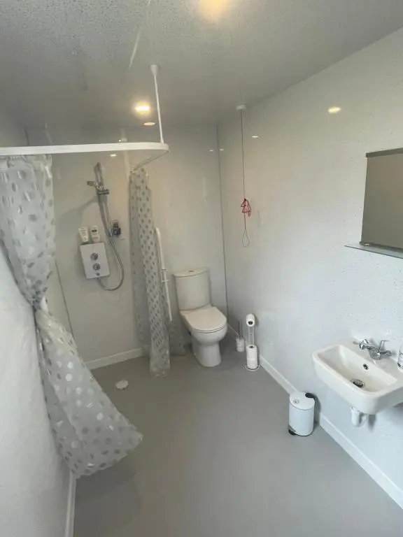 a bathroom with a toilet and a sink at 1 Lighthouse View in Lossiemouth
